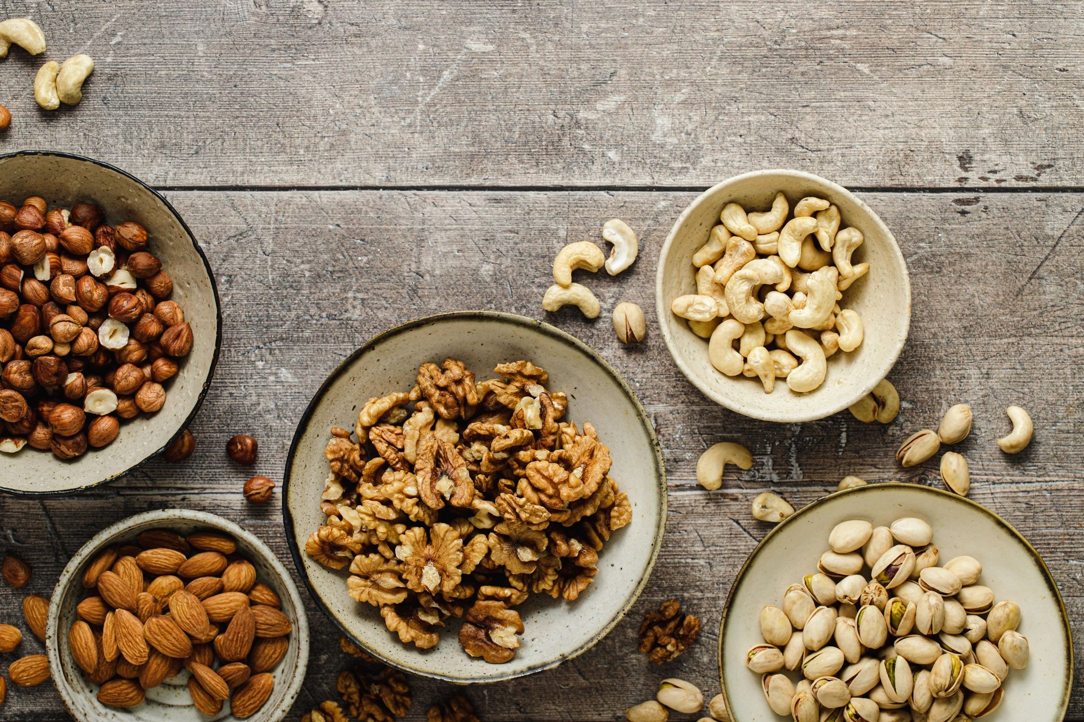 Assortment of nuts and dried fruit in bowls