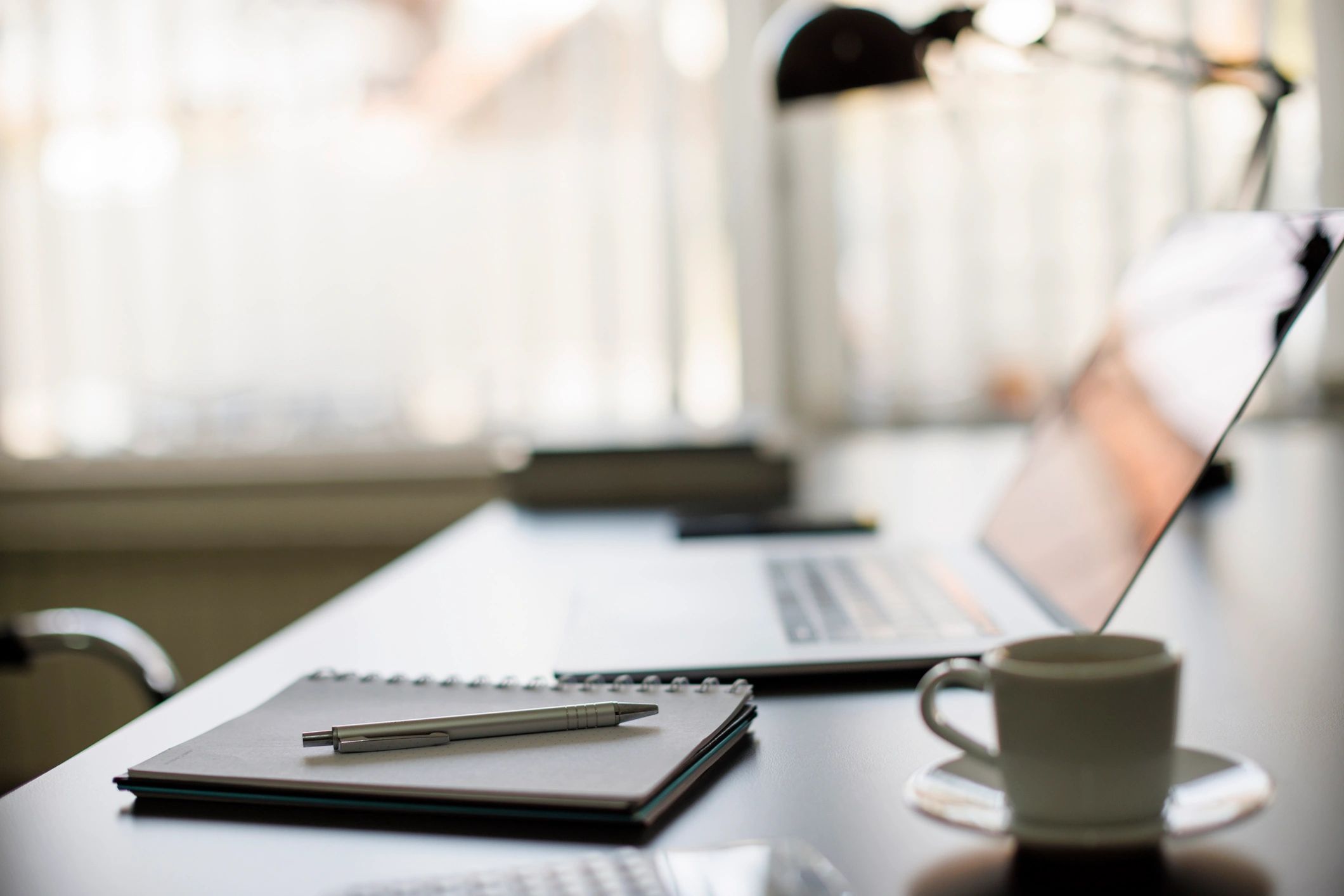 Laptop with a simple budget spreadsheet on a desk