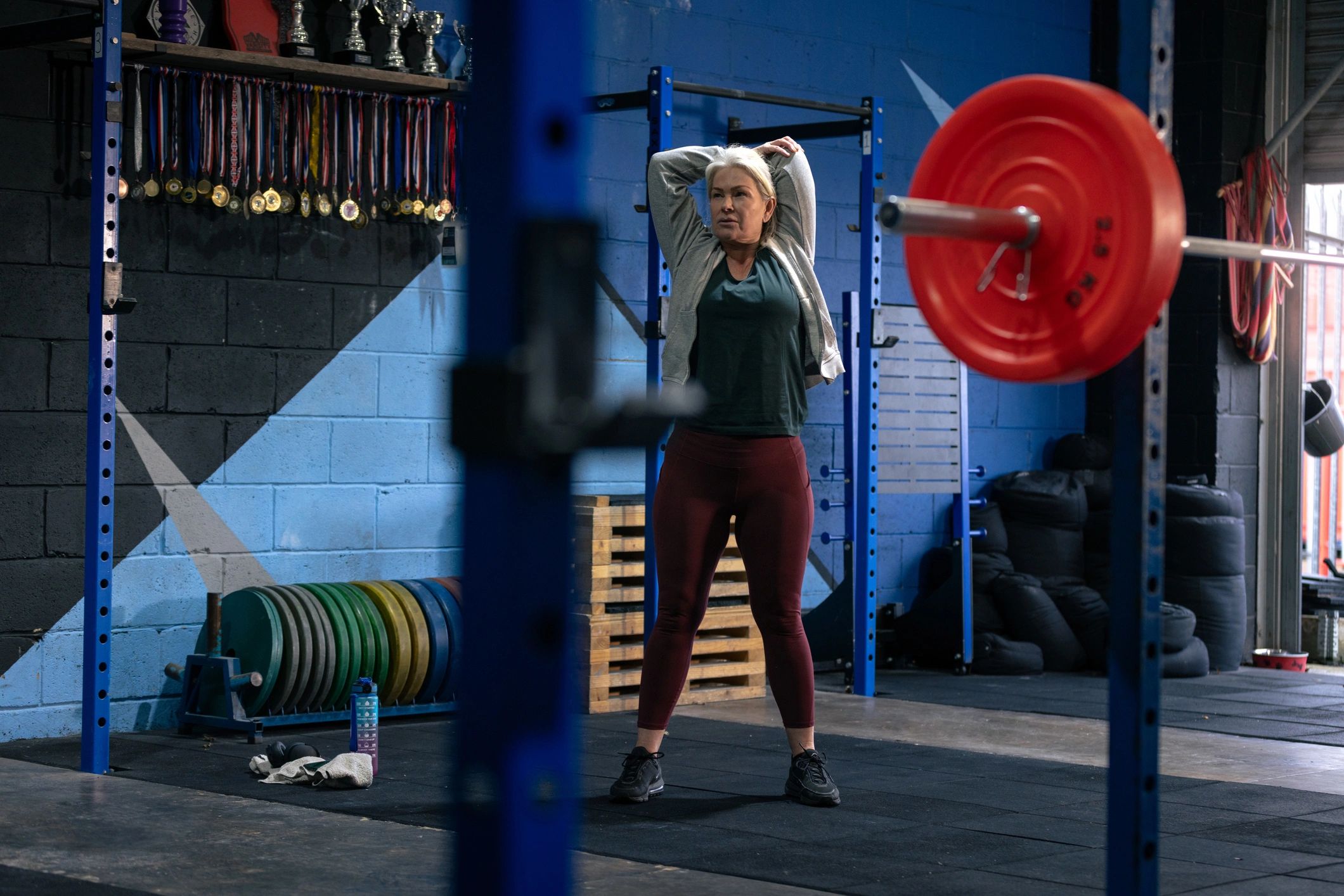 Adult warming up and stretching in a gym before a workout