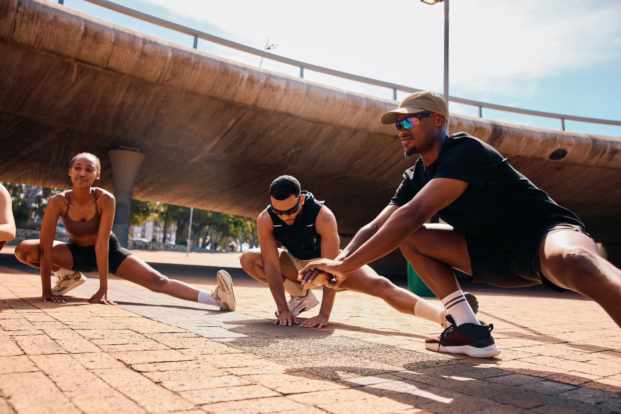 Group doing warm-up lunges outdoors